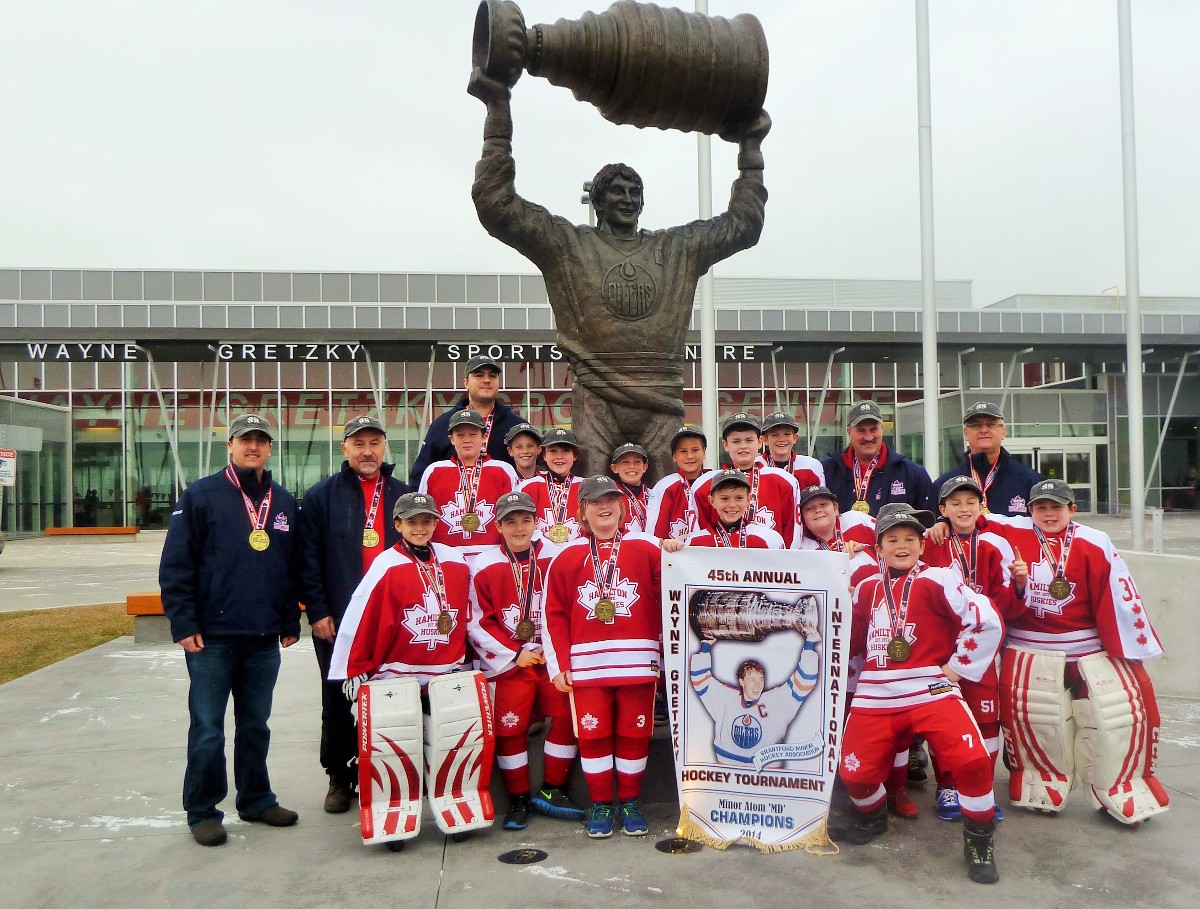 3_team_with_statue_-_coaches.JPG